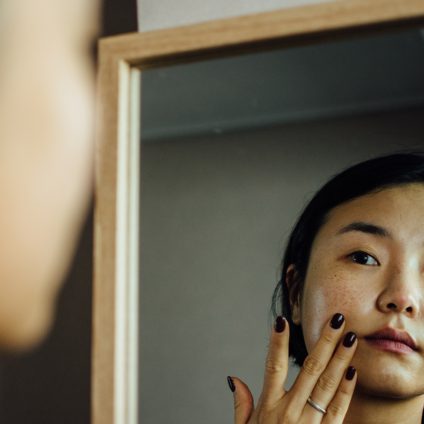 Applying Moon mushroom peptide serum to face